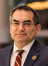 Man in a suit with striped tie,